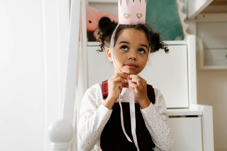 a little girl with a crown on her head, pexels contest winner, happening, playful smirk, eva elfie, decoration, thumbnail