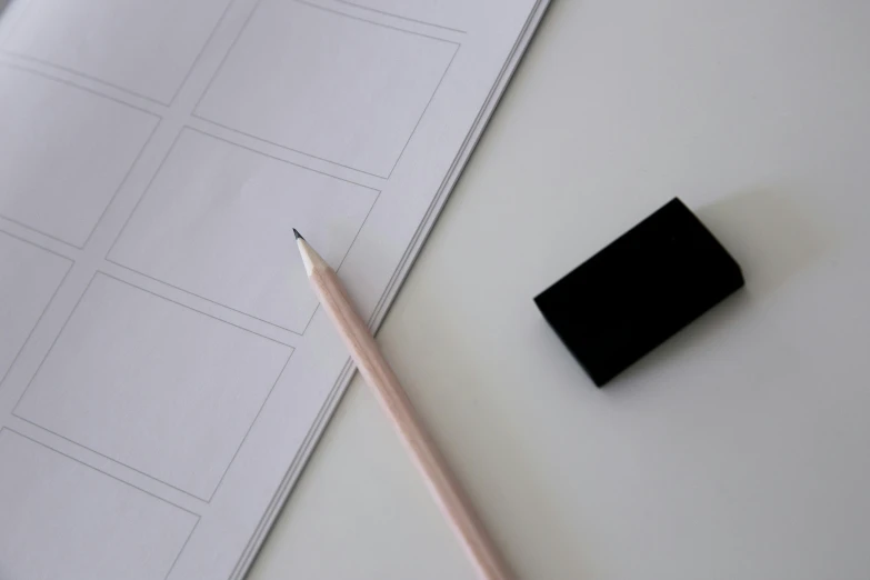 a pencil sitting on top of a piece of paper next to a cell phone, for a catalogue, black on white paper, storyboard, square shapes