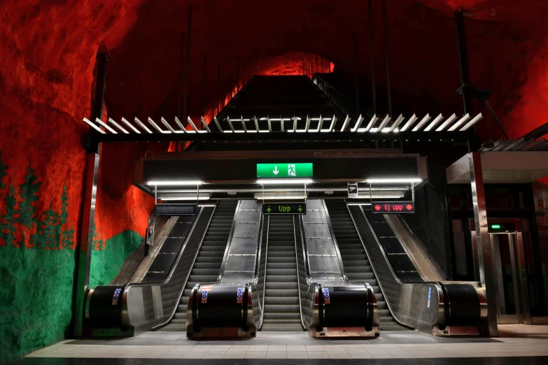 a couple of escalators sitting next to each other, by Jens Søndergaard, green and red, flooded station, 1 2 9 7, square