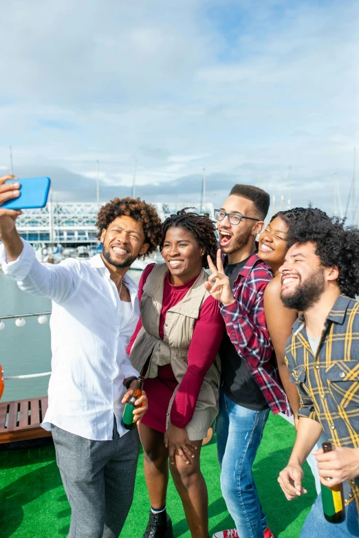 a group of people taking a selfie on a boat, with afro, striking pose, high-resolution photo, essence