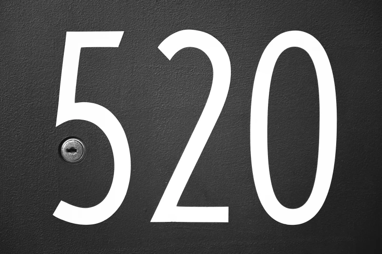 a close up of a number sign on a wall, by Matt Cavotta, pixabay, white font on black canvas, 2050, 2 5 6 x 2 5 6, letterbox