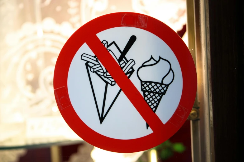 a no ice cream sign hanging from the side of a window, pexels, vienna secesion style, miscellaneous objects, ilya kushinov, no logo