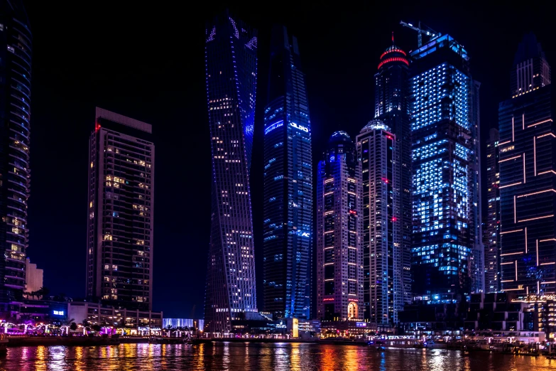 a large body of water surrounded by tall buildings, by Erik Pevernagie, pexels contest winner, arabian nights, photo taken from a boat, stunning high tech, three towers