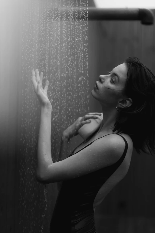 a woman standing in front of a shower head, a black and white photo, by Felix-Kelly, unsplash contest winner, krysten ritter, soft devil queen madison beer, deviantart artstation cgscosiety, condensation