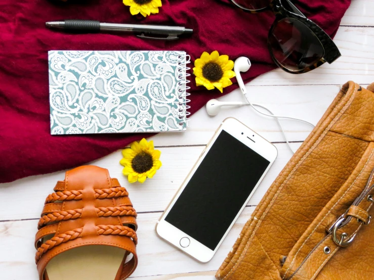 a purse, cell phone and sunflowers on a table, trending on pexels, avatar image, flatlay, smart textiles, brown