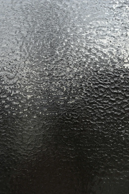 a close up of a frosty surface on a window, a stipple, inspired by Arthur Burdett Frost, unsplash, black lacquer, sweaty face, liquid polished metal, water running down the walls