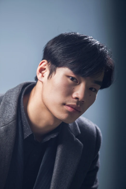 a man in a suit posing for a picture, inspired by Joong Keun Lee, chiseled jawline, portrait of merlin, dark. no text, square