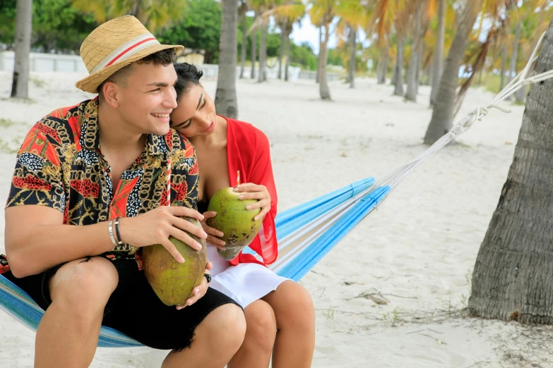 a man and woman sitting in a hammock on the beach, pexels contest winner, renaissance, coconuts, avatar image, handsome man, holding close