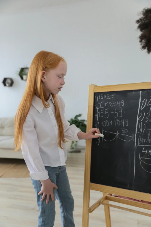 a woman teaching a young girl how to write on a blackboard, pexels contest winner, interactive art, ginger hair with freckles, 15081959 21121991 01012000 4k, scene from live action movie, balancing the equation