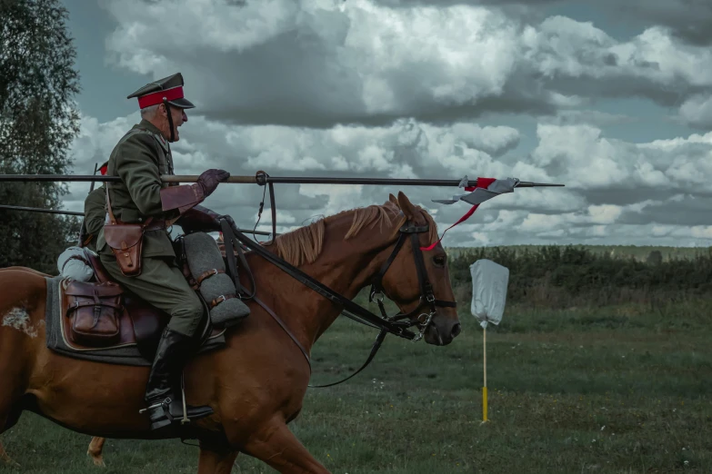 a man riding on the back of a brown horse, a colorized photo, by Adam Marczyński, pexels contest winner, a soldier aiming a gun, cosplay photo, holding a spear, typical russian atmosphere