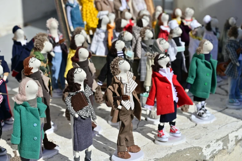 a group of stuffed animals standing next to each other, by Sylvia Wishart, cg society contest winner, figuration libre, brutalist fashion show, people in the streets, made of felt and cloth and beads, winter sun