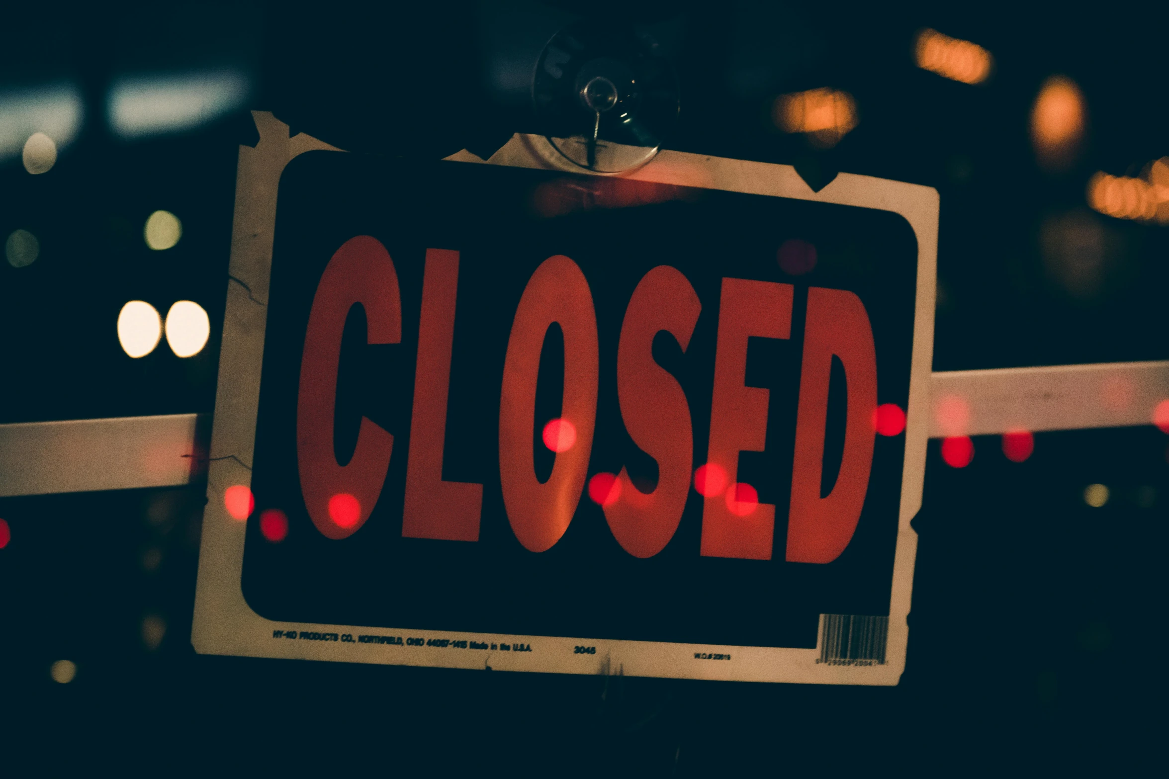 a close up of a closed sign on a fence, by Daniel Lieske, pexels, red neon lights inside it, furniture overturned, 🚿🗝📝