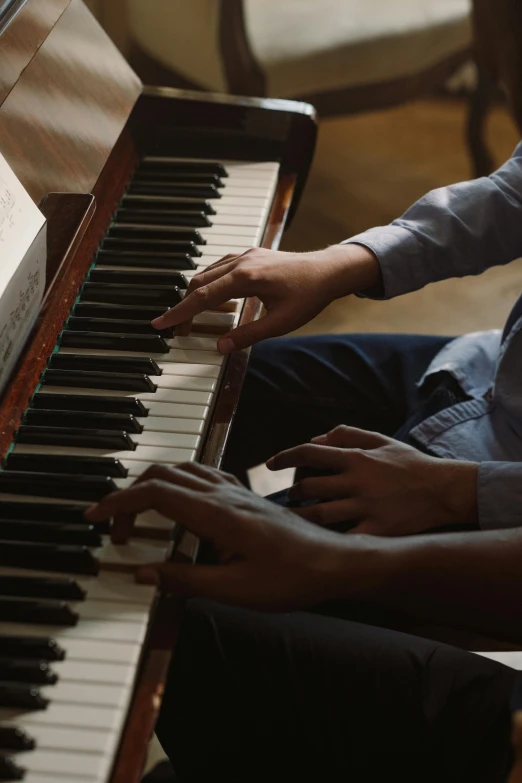 a couple of people that are playing a piano, by David Simpson, cinematic, zoomed out shot, multiple stories, premium quality