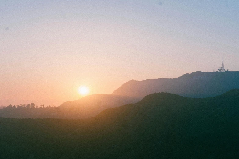 the sun is setting over a mountain range, pexels contest winner, malibu canyon, faded and dusty, sweltering, lofi