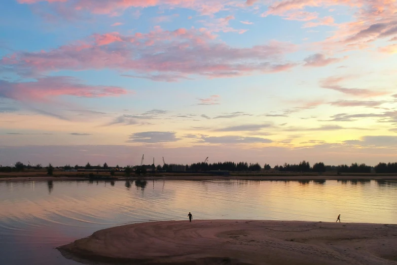 a person standing on a beach next to a body of water, a picture, pink skies, red river, hoang lap, complex scene