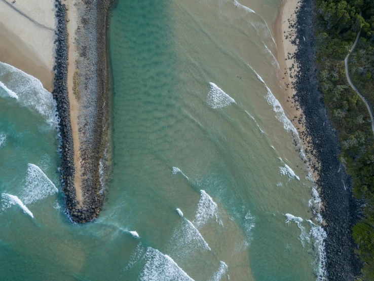 a large body of water next to a beach, by Peter Churcher, pexels contest winner, land art, birdseye view, gold coast australia, twisted waterway, image split in half