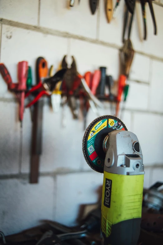 a bunch of tools are hanging on a wall, a portrait, pexels contest winner, colorful clear sharp focus, profile image, circular, formula 1 garage