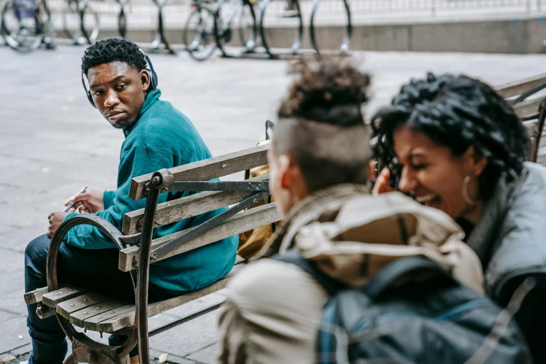 a couple of people that are sitting on a bench, trending on pexels, happening, black teenage boy, a group of people, humans of new york, timid and vulnerable expression