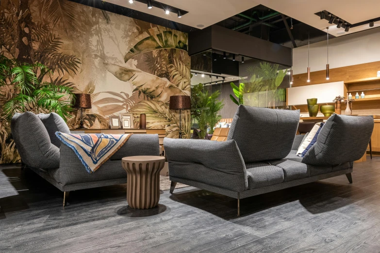 a living room with two couches and a coffee table, by Andries Stock, pexels contest winner, maximalism, tropical forest, modern gallery furniture, show room scene, youtube thumbnail