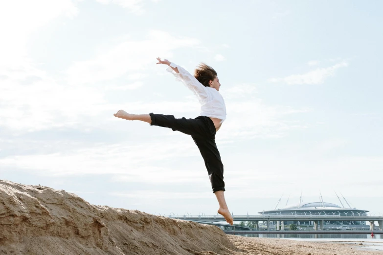 a man flying through the air while riding a skateboard, unsplash, arabesque, girl dancing on cliff, karate kick, little kid, profile pic