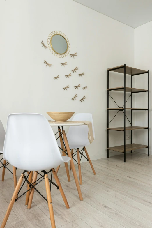 a dining room filled with white chairs and a wooden table, inspired by Reinier Nooms, pexels contest winner, light and space, insects and birds, 256x256, city apartment cozy calm, shelves