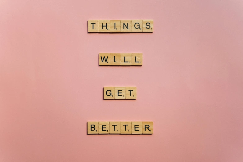 a sign that says things will get better, minimalism, light pink background, tiles, effective altruism, good photography