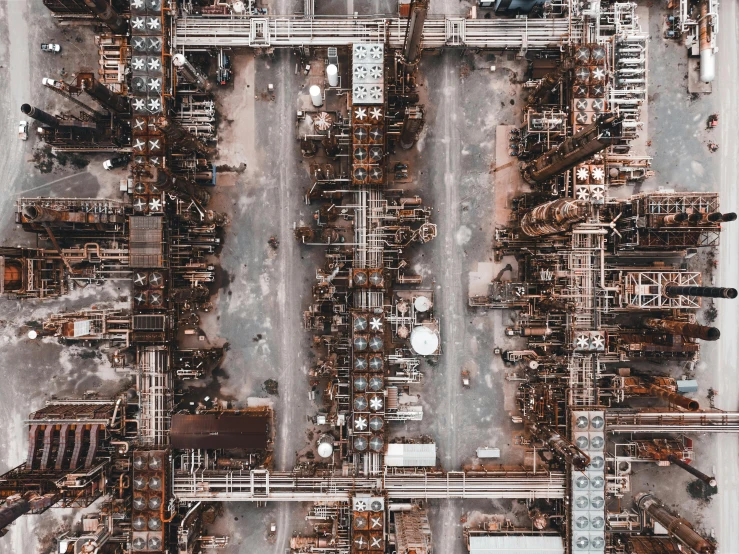 an aerial view of a factory with lots of machinery, inspired by Andreas Gursky, pexels contest winner, intricate oil details, worksafe. instagram photo, rusted, an ultra realistic