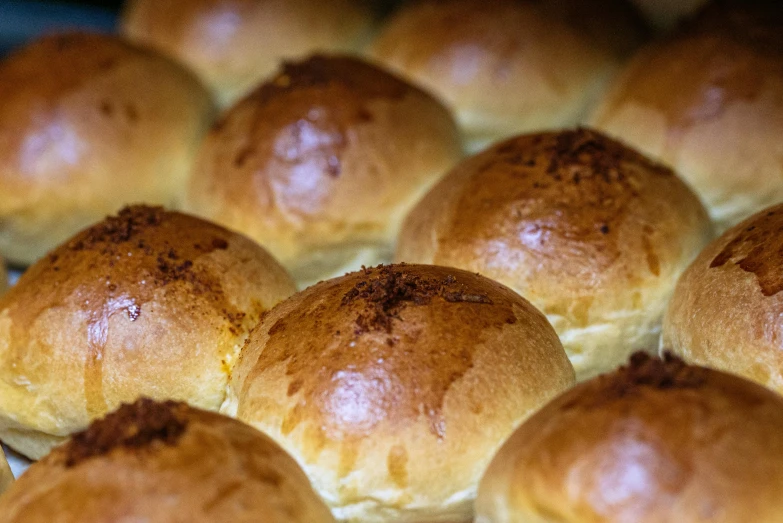 a bunch of buns sitting on top of a pan, by Joe Bowler, unsplash, bottom body close up, spherical, puff sleeves, colombian