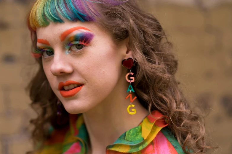 a close up of a person with colorful hair, an album cover, by Lee Gatch, trending on pexels, huge earrings and queer make up, joey king, gauges, trending on gc society