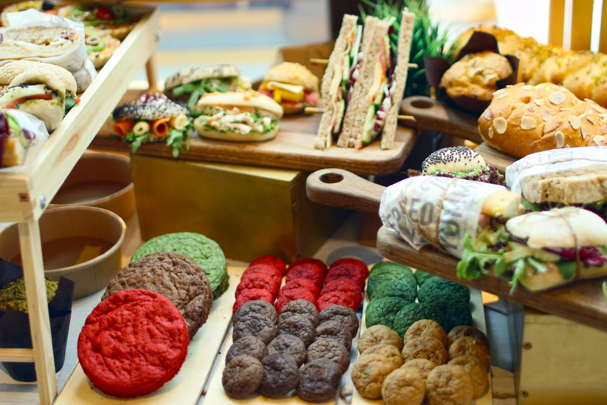 a display case filled with lots of different types of food, crispy buns, red and green palette, thumbnail, lots of sunlight