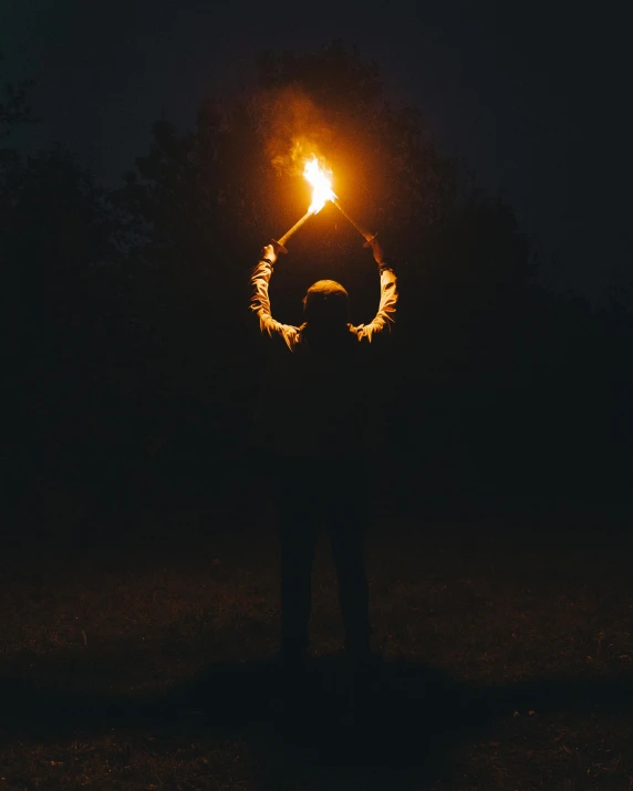 a person holding a sparkler in the dark, by Attila Meszlenyi, holding axe, halo above head, no watermarks, holding a lantern