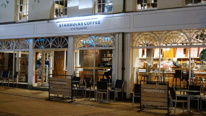 a starbucks coffee shop is lit up at night, by Emma Andijewska, renaissance, profile image, esher, square, scientific photo