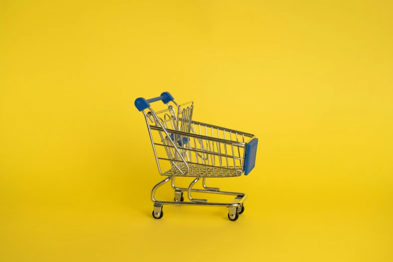 a shopping cart on a yellow background, pexels, hyperrealism, blue print, instagram picture, kid, no watermarks