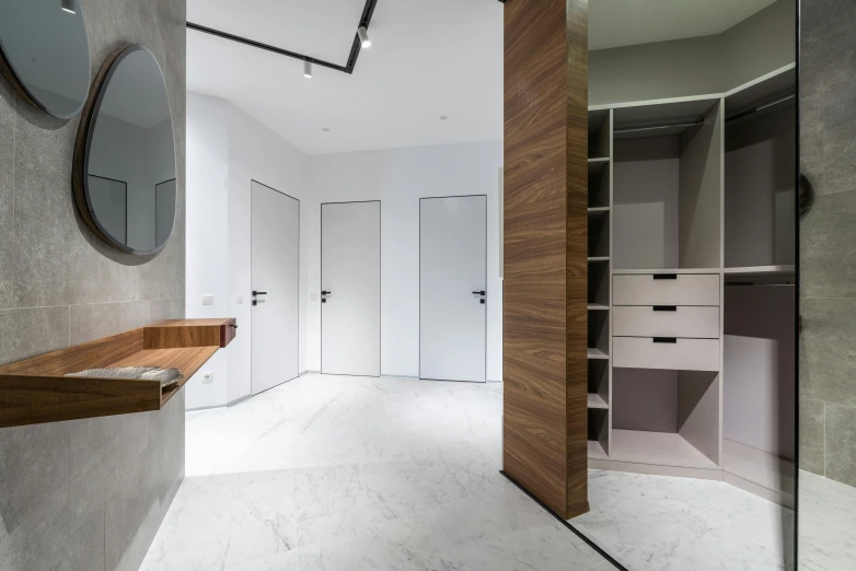 a bath room with a toilet a sink and a mirror, a 3D render, unsplash, two wooden wardrobes, white marble interior photograph, locker room, thumbnail