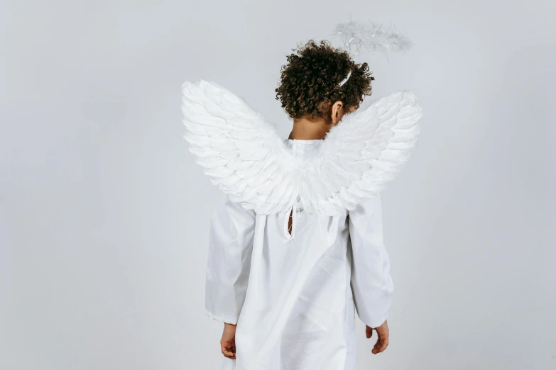 a little girl dressed up as an angel, pexels, plain background, back facing, 15081959 21121991 01012000 4k, miniature product photo