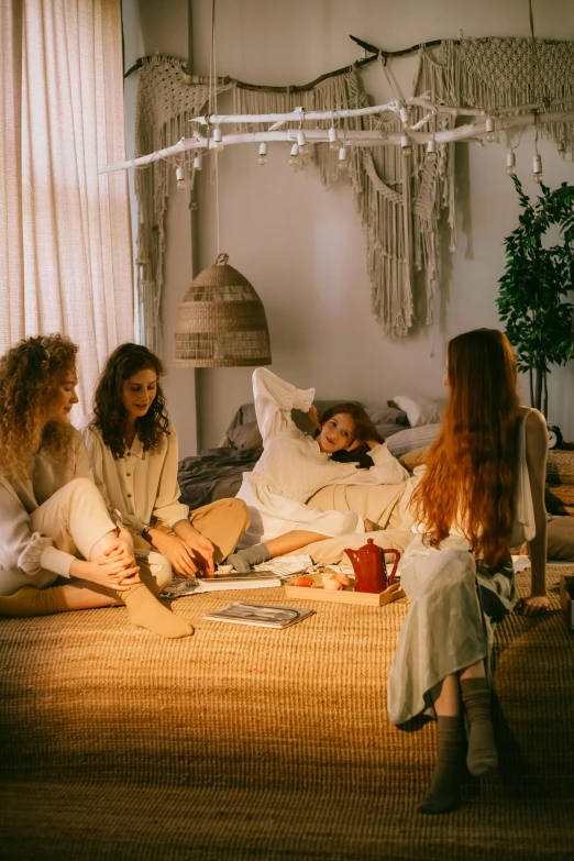 a group of women sitting on top of a bed, trending on pexels, renaissance, hippie pad, calmly conversing 8k, decoration around the room, 15081959 21121991 01012000 4k