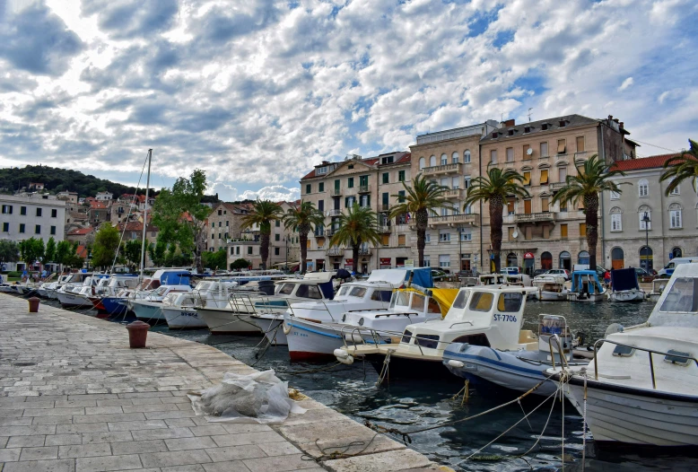 a bunch of boats that are sitting in the water, pexels contest winner, white marble buildings, split near the left, thumbnail, square