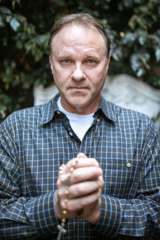 a man holding a tennis racquet in his hands, an album cover, inspired by John E. Berninger, anthony hopkins, portrait image, lgbtq, peter paul rebens