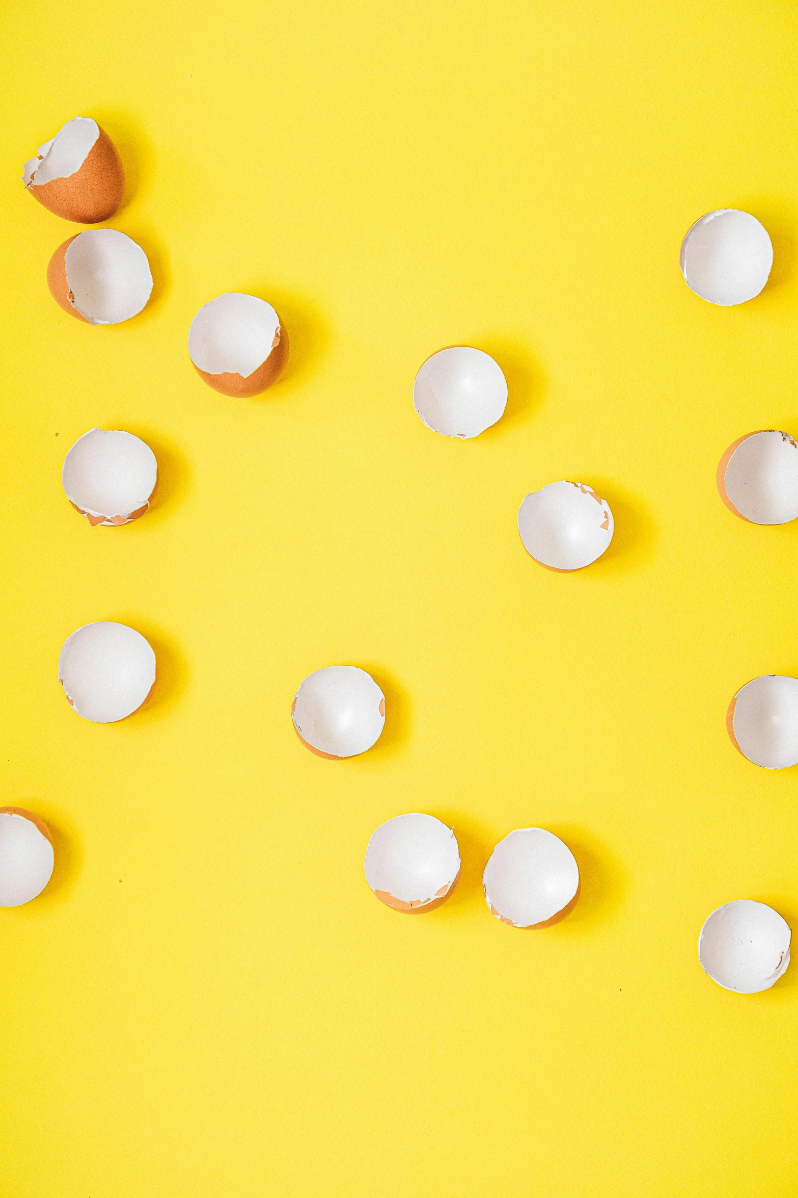 broken eggs on a yellow background, by Lucette Barker, trending on unsplash, minimalism, cups and balls, fairy circles, 64x64, detail shot