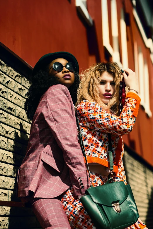 a couple of women standing next to each other, trending on pexels, renaissance, neon jungle, wearing jacket and skirt, deep colour\'s, prints