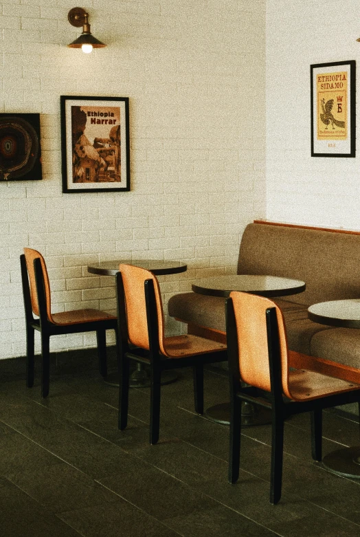 a couple of tables and some chairs in a room, a portrait, inspired by Charles W. Bartlett, trending on unsplash, modernism, regal fast food joint, vintage soft grainy, low detail, brown