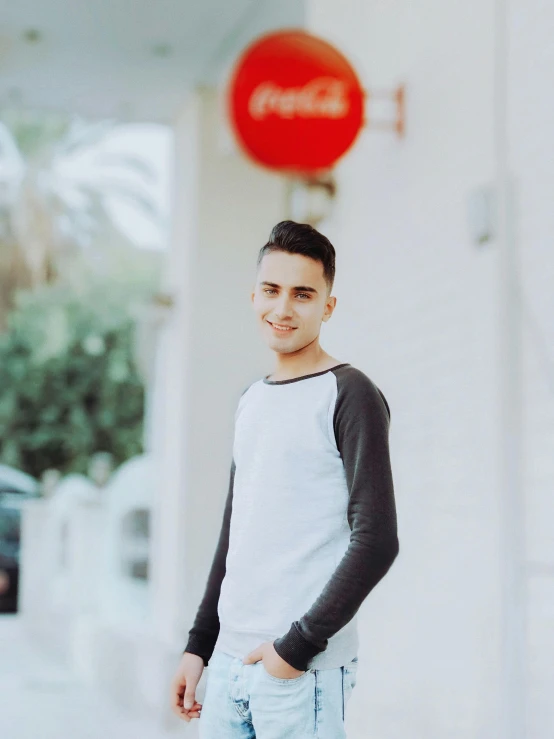 a young man standing in front of a building, tinder profile, arabian, profile image, large)}]