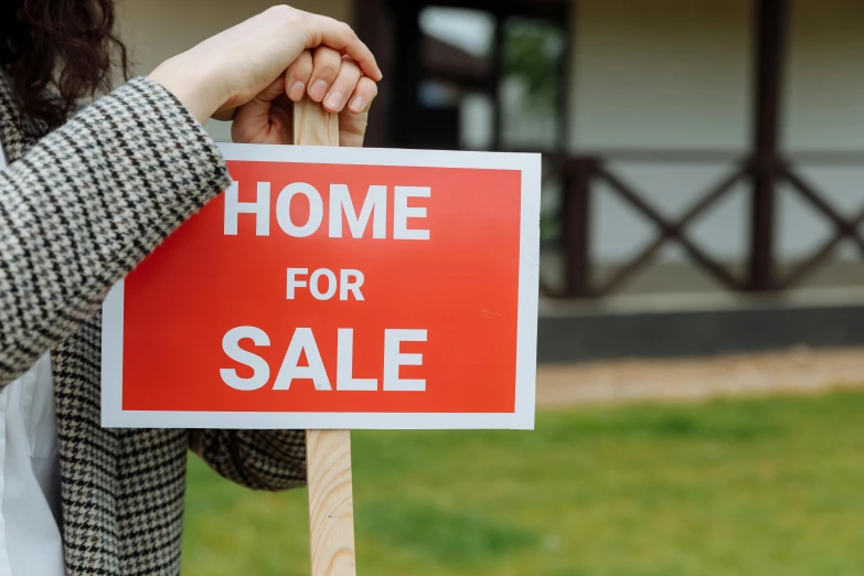 a woman holding a sign that says home for sale, hurufiyya, thumbnail, 1x, prop, hongbsws