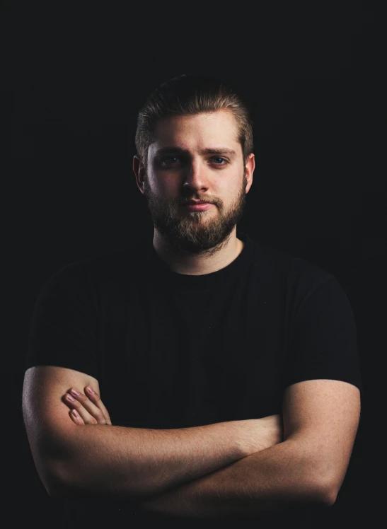 a man in a black shirt with his arms crossed, a portrait, reddit, threyda, discord profile picture, profile image, dark photo