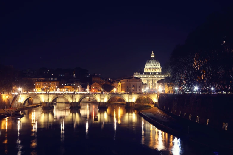 a view of a bridge over a river at night, by Cagnaccio di San Pietro, pexels contest winner, neoclassicism, with great domes and arches, holiday season, instagram photo, instagram post