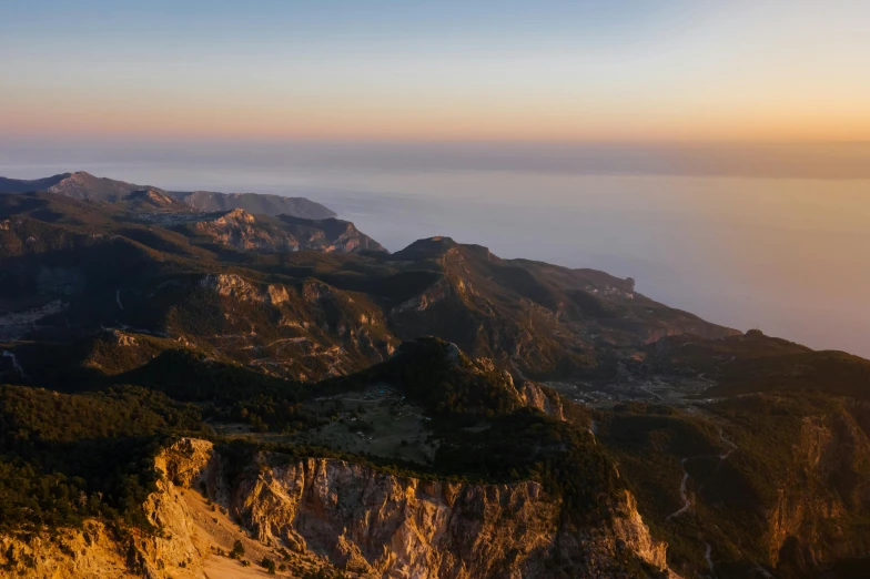 a group of people standing on top of a mountain, unsplash contest winner, les nabis, costa blanca, “ aerial view of a mountain, late summer evening, capri coast