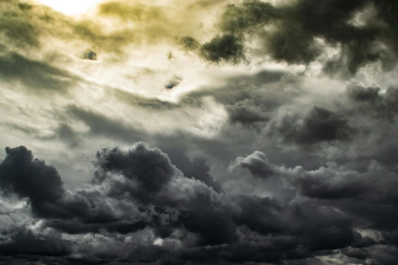 a large body of water under a cloudy sky, an album cover, pexels contest winner, romanticism, dark mammatus cloud, grey, toxic clouds, hd footage