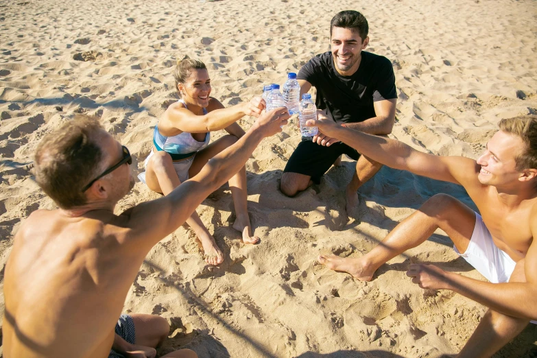 a group of people sitting on top of a sandy beach, holding a bottle, avatar image, sport, costa blanca