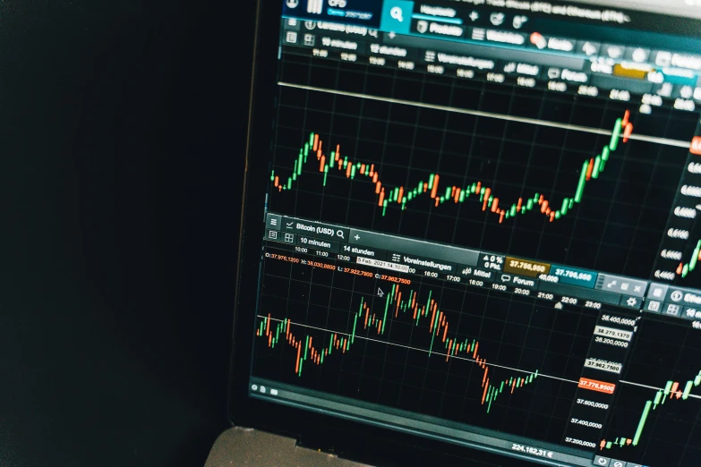 a laptop computer sitting on top of a desk, pexels, analytical art, trading stocks, fibonacci pattern, mining, movie screen shot