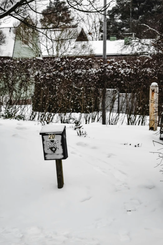 a wooden bench covered in snow next to a building, an album cover, by Daarken, private press, an overgrown library, sign, today\'s featured photograph 4k, ahhhhhhh